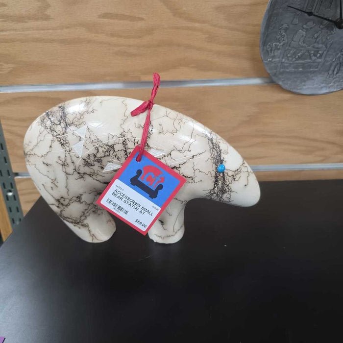 SMALL BEAR STATUE AT